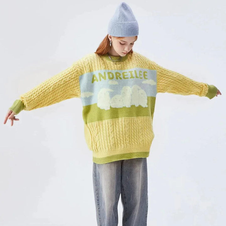 Zopfstrickpullover mit Pastell-Wolkenmotiv